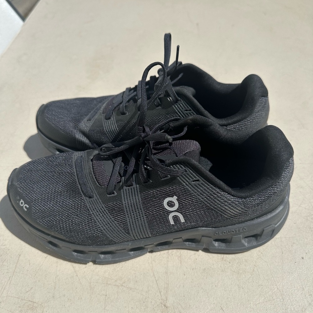 On Running Black and Gray Athletic Shoes with CloudTec Technology